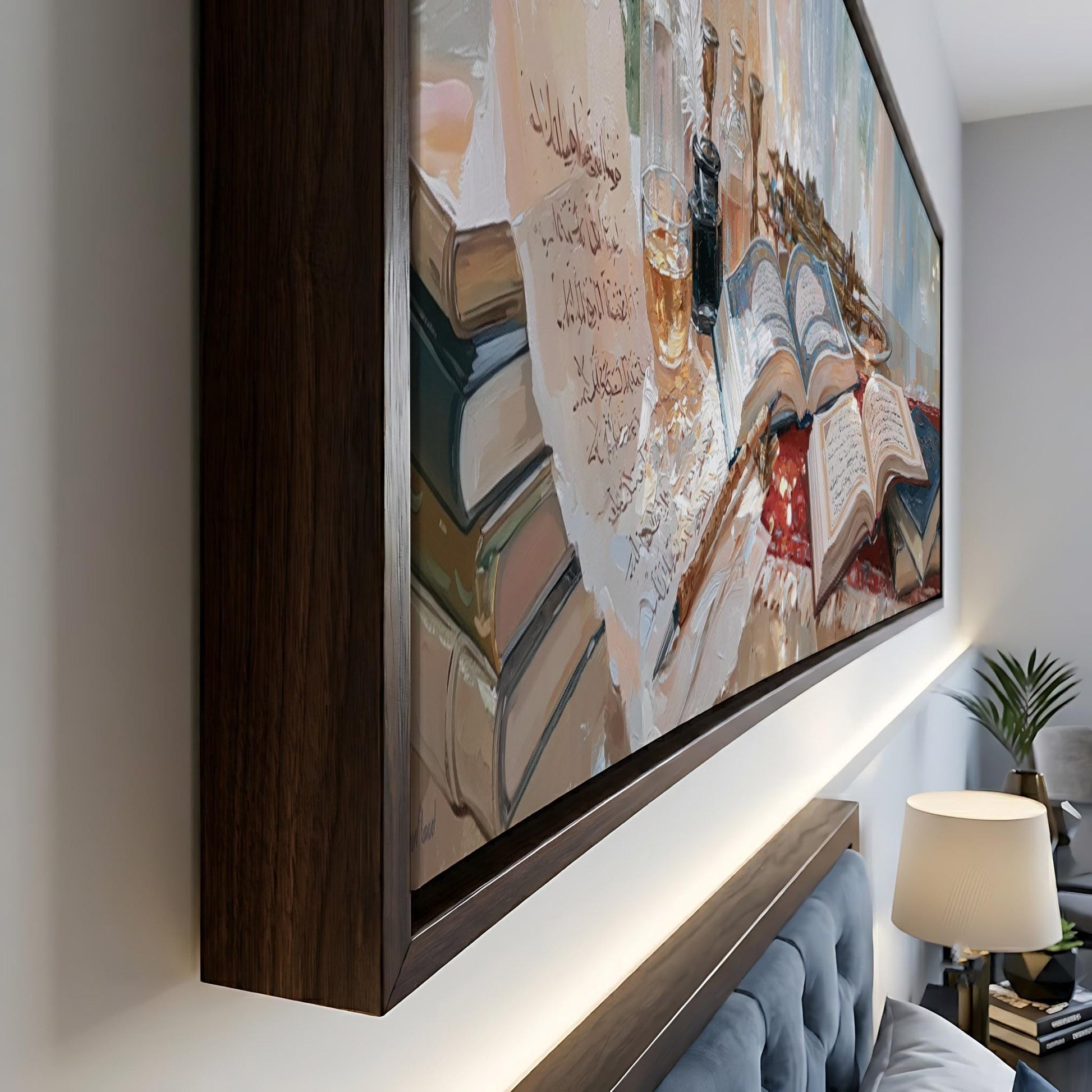 a large framed painting depicting a scene with books, a glass, and a plant, hanging on a wall in a room.
