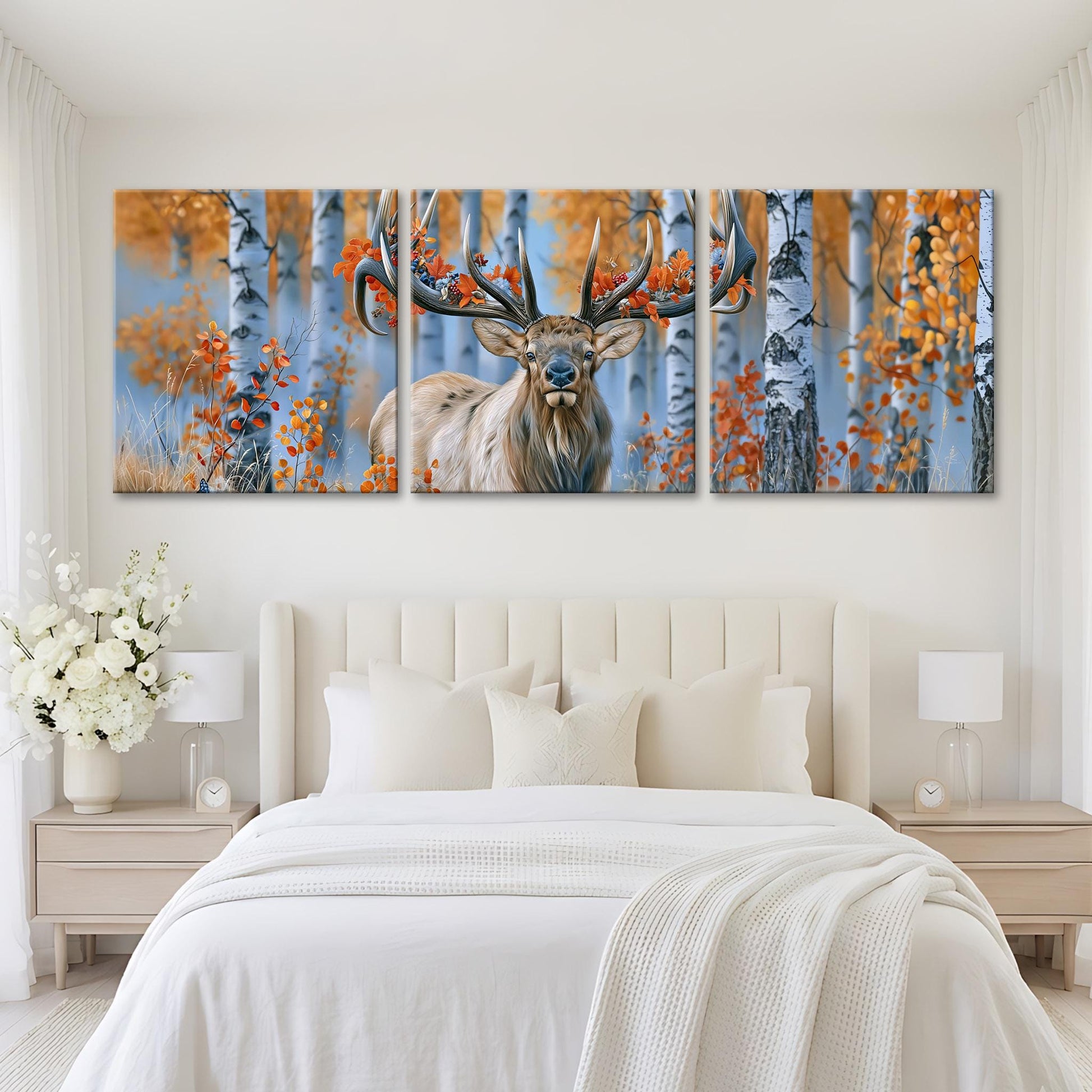A large, three-panel painting of a deer with antlers in a forest setting, featuring a mix of red and orange foliage.